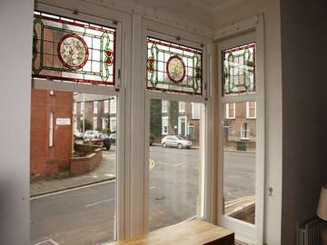 Mr D. : Northwich Cheshire. Installation of Bygone White foil sliding sash windows encapsulating original stained leaded lights 